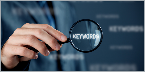 Magnifying glasses on the word "keyword" meant to depict SEO keyword research