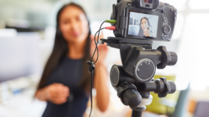 Women recording herself on a camera